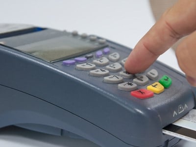 person using a credit card reader