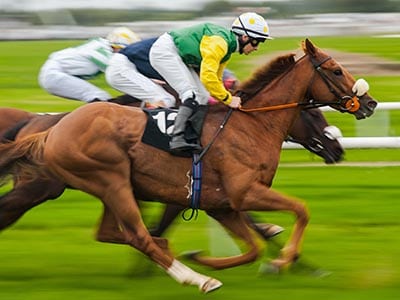 jockey racing on horse