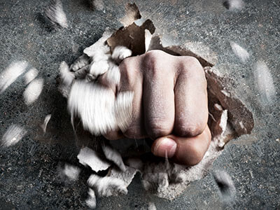 hand punching through wall