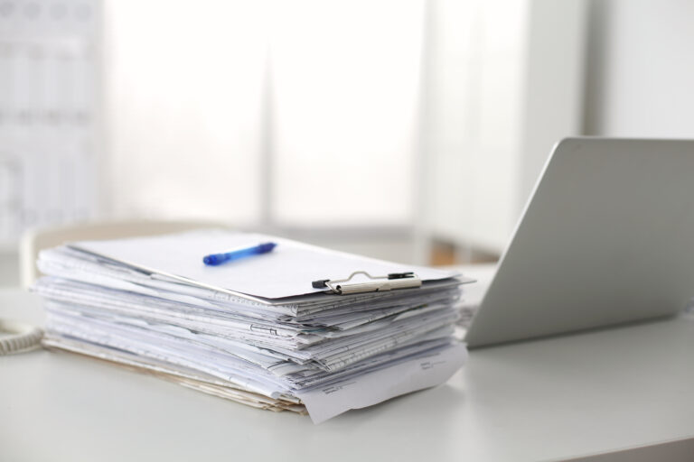 Stack of Paper on desk